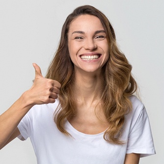 young woman giving a thumbs up