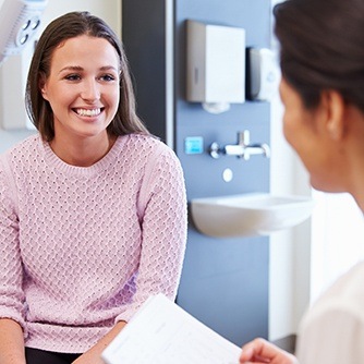 Smiling woman in dental exam room