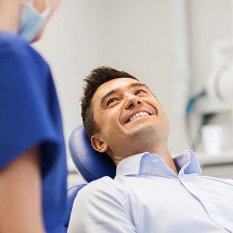 Smiling man in dental chair