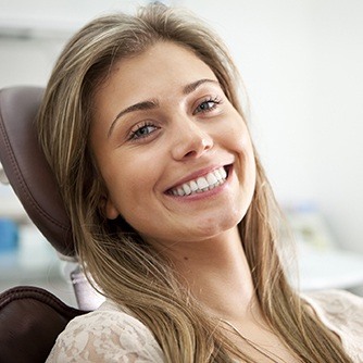 Smiling woman in dental chair