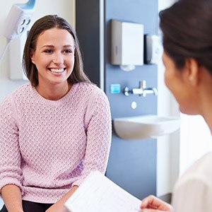 Woman in dental chair smiling