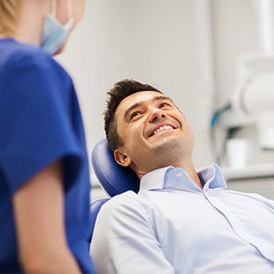 Smiling man in dental chair