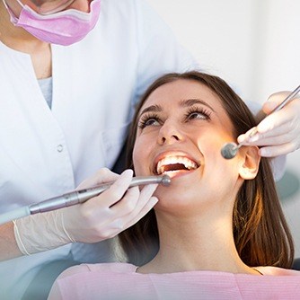 Woman receiving teeth cleaning