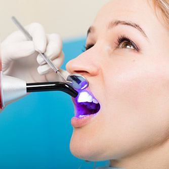 Woman receiving direct bonding treatment