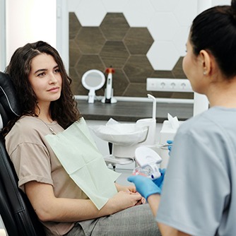 Female patient speaking with dentist