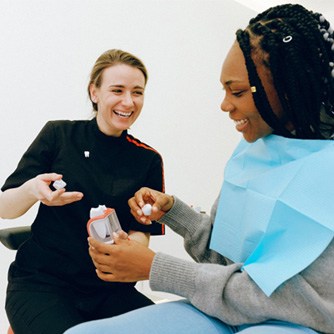 Dentist discussing dental crown with patient