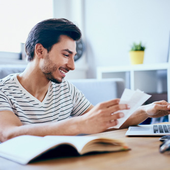 Farmington patient learning about dental implant cost 