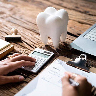 An insurance agent working on a dental insurance form