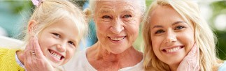 Mother daughter and grandmother smiling