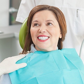 Smiling older woman in dental chair