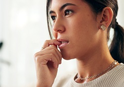 Closeup of woman biting her nails