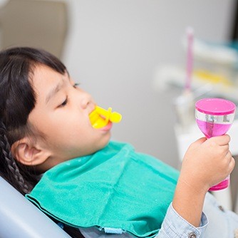 Child receiving fluoride treatment