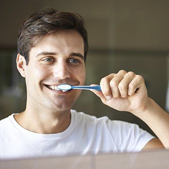 Man brushing teeth