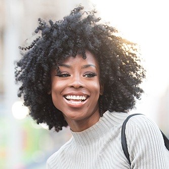 Woman smiling outdoors