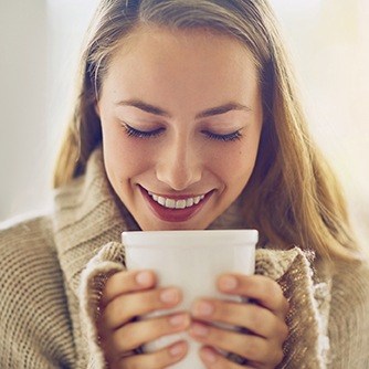 Woman holding coffee cup