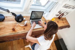 A woman working on a computer.