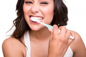 woman practicing excellent oral hygiene