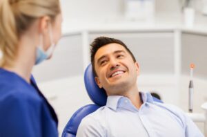 Man smiling at his dental hygienist