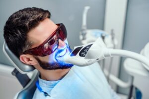 Patient having his teeth whitened.